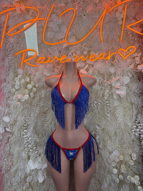 Patriotic two-piece fringe outfit with blue halter top, red trim, and blue tassel bottoms