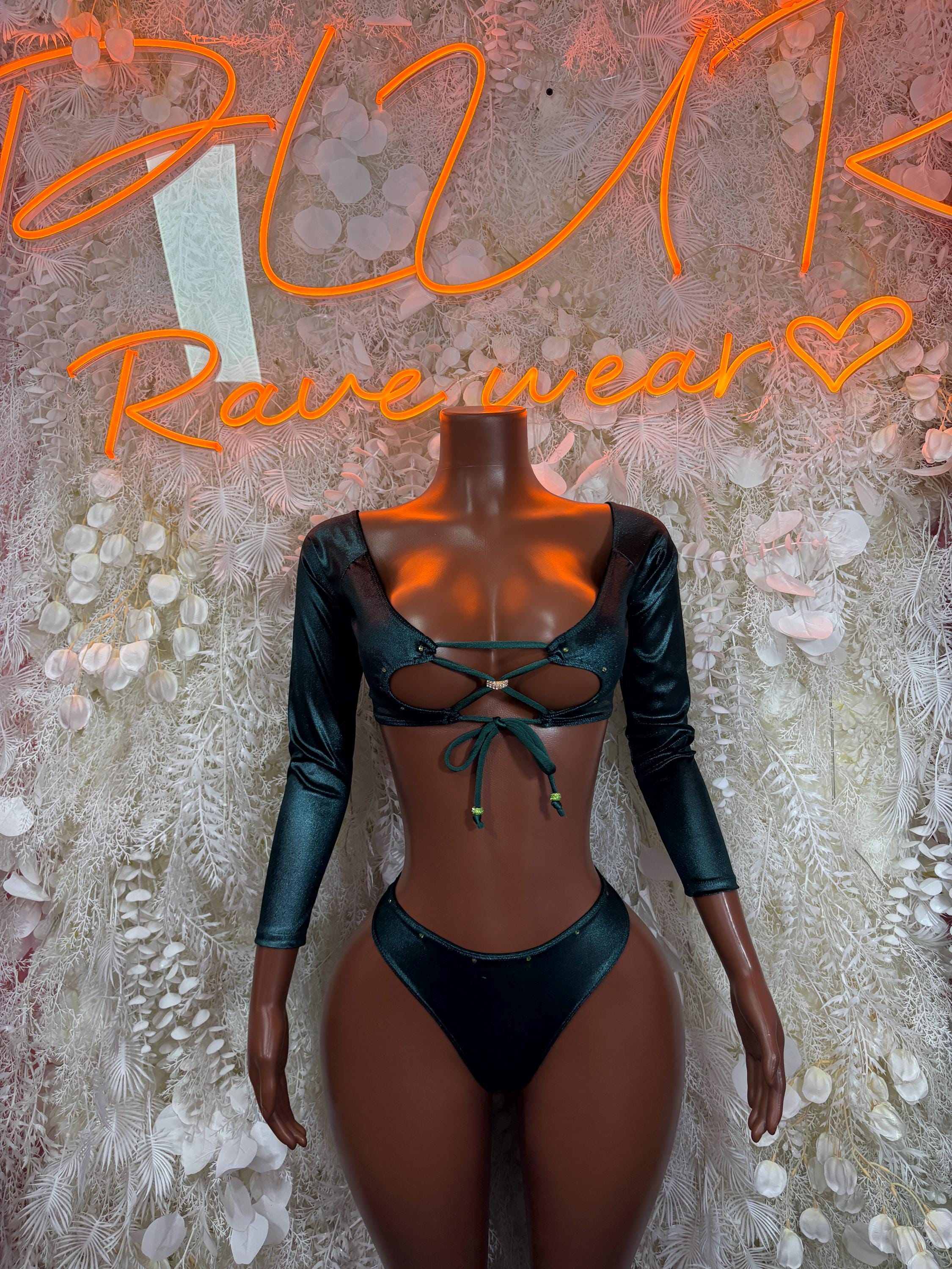 Green two-piece rave set: long-sleeve cropped top with lace-up front and high-cut bottoms
