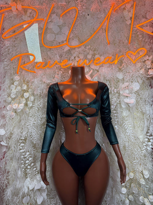 Green two-piece rave set: long-sleeve cropped top with lace-up front and high-cut bottoms