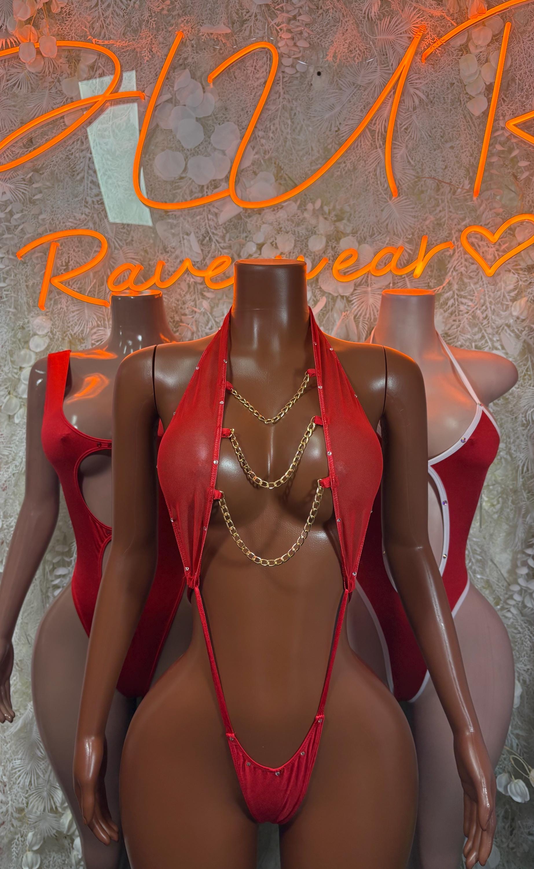 Red halter bikini-style rave outfit with layered chain necklace and micro briefs