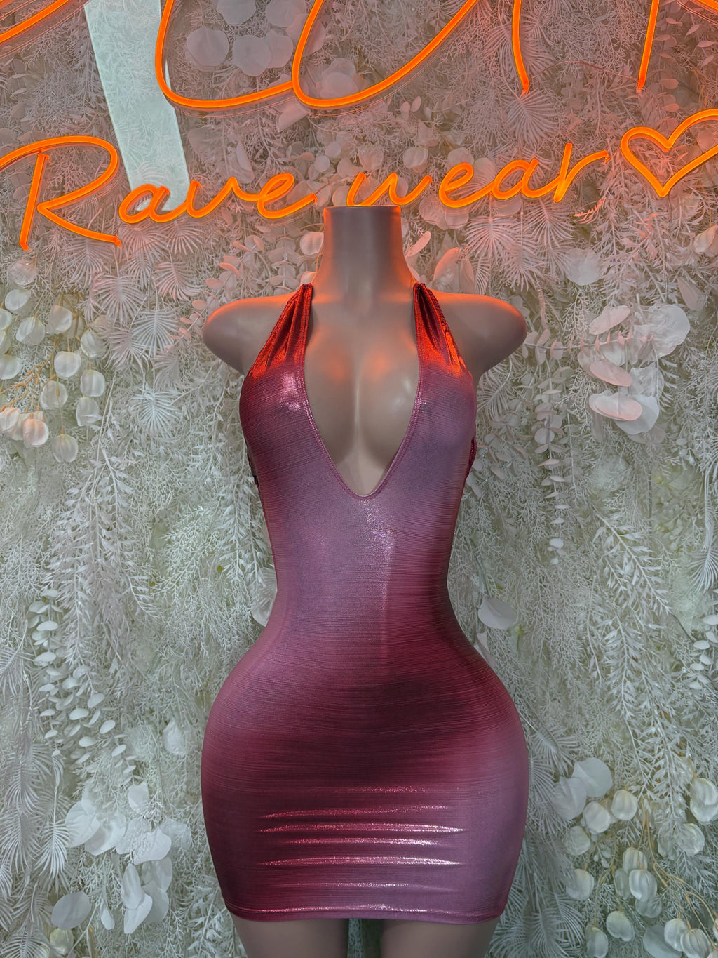 Metallic pink mini dress with deep V neckline and fitted bodycon silhouette