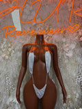 White lace one-piece dancewear with V-neck front and thin straps