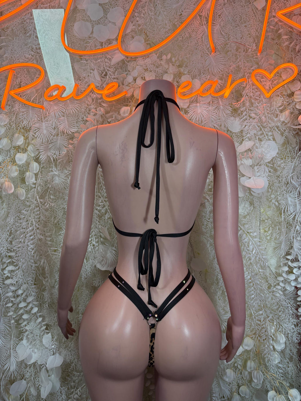 Rave bikini set back view with black tie strings and leopard print side bands
