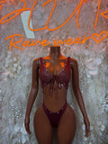 Burgundy sleeveless V-neck bodysuit with center tie and high-cut thong-style bottom