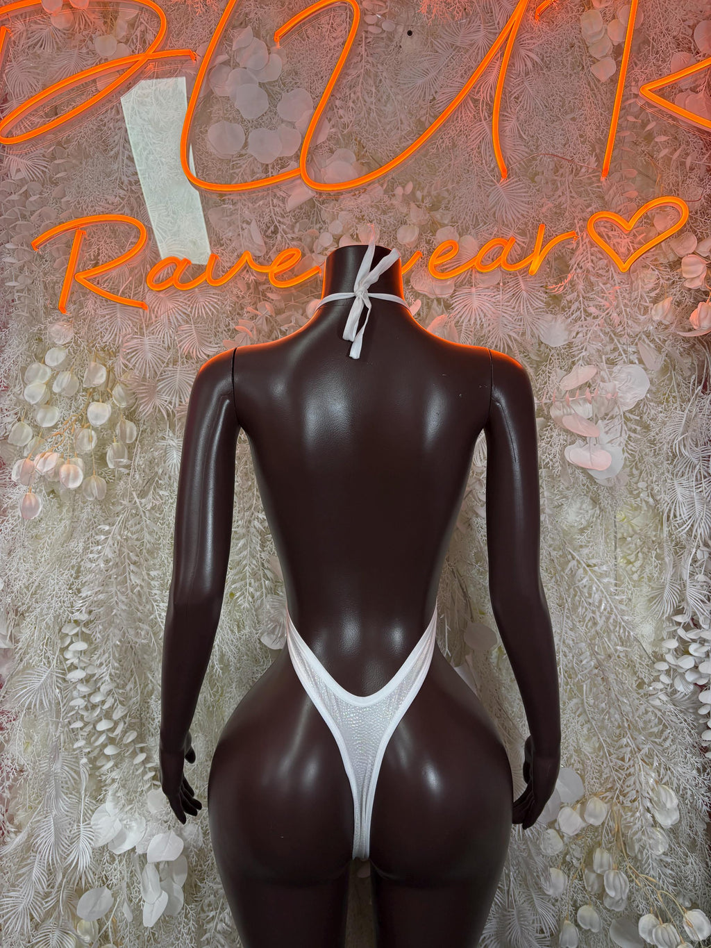 White rave bodysuit with deep V back cutout and thin straps, sleeveless