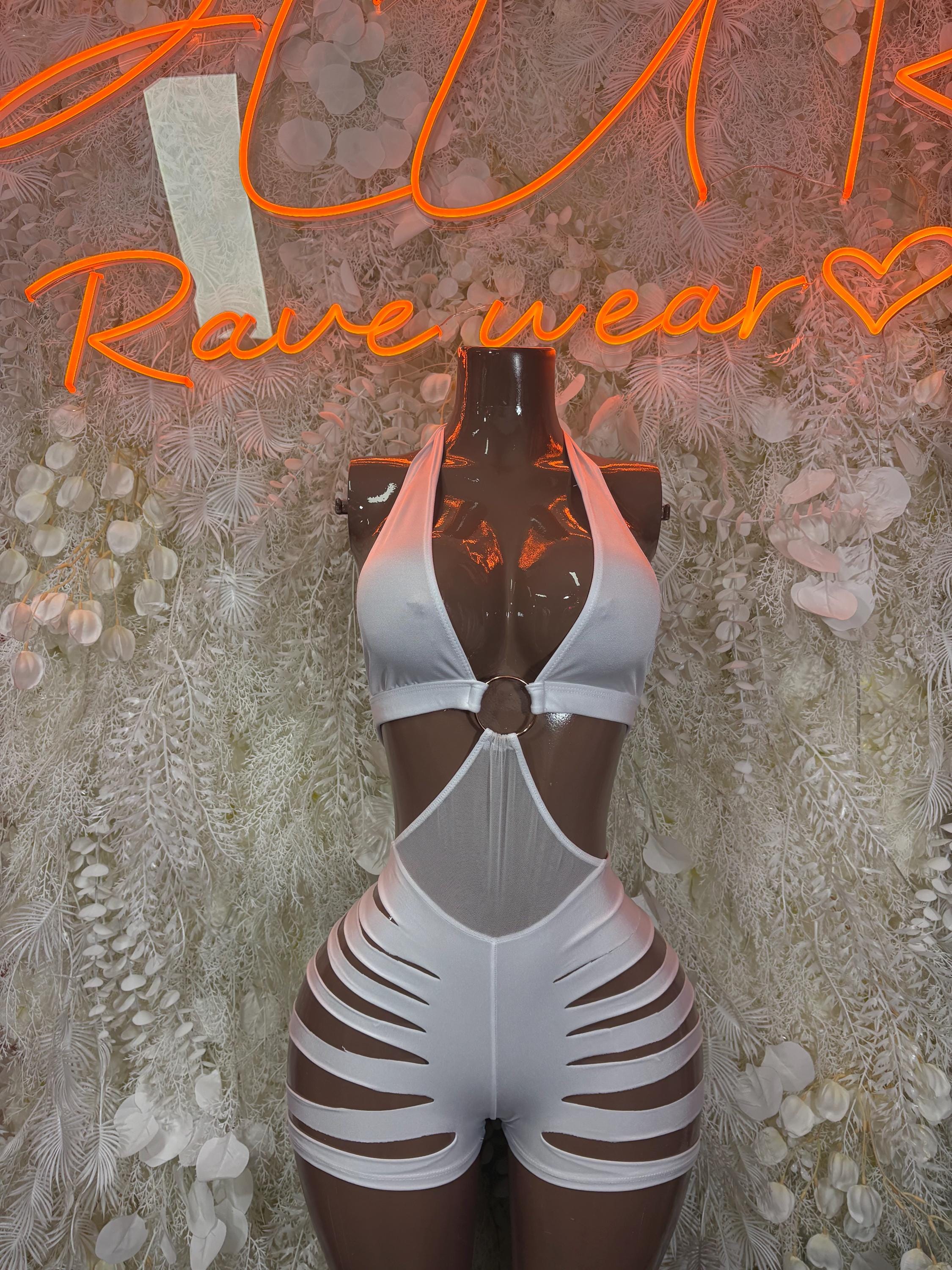White festival bodysuit with halter straps, chest cutout, and slashed thigh panels