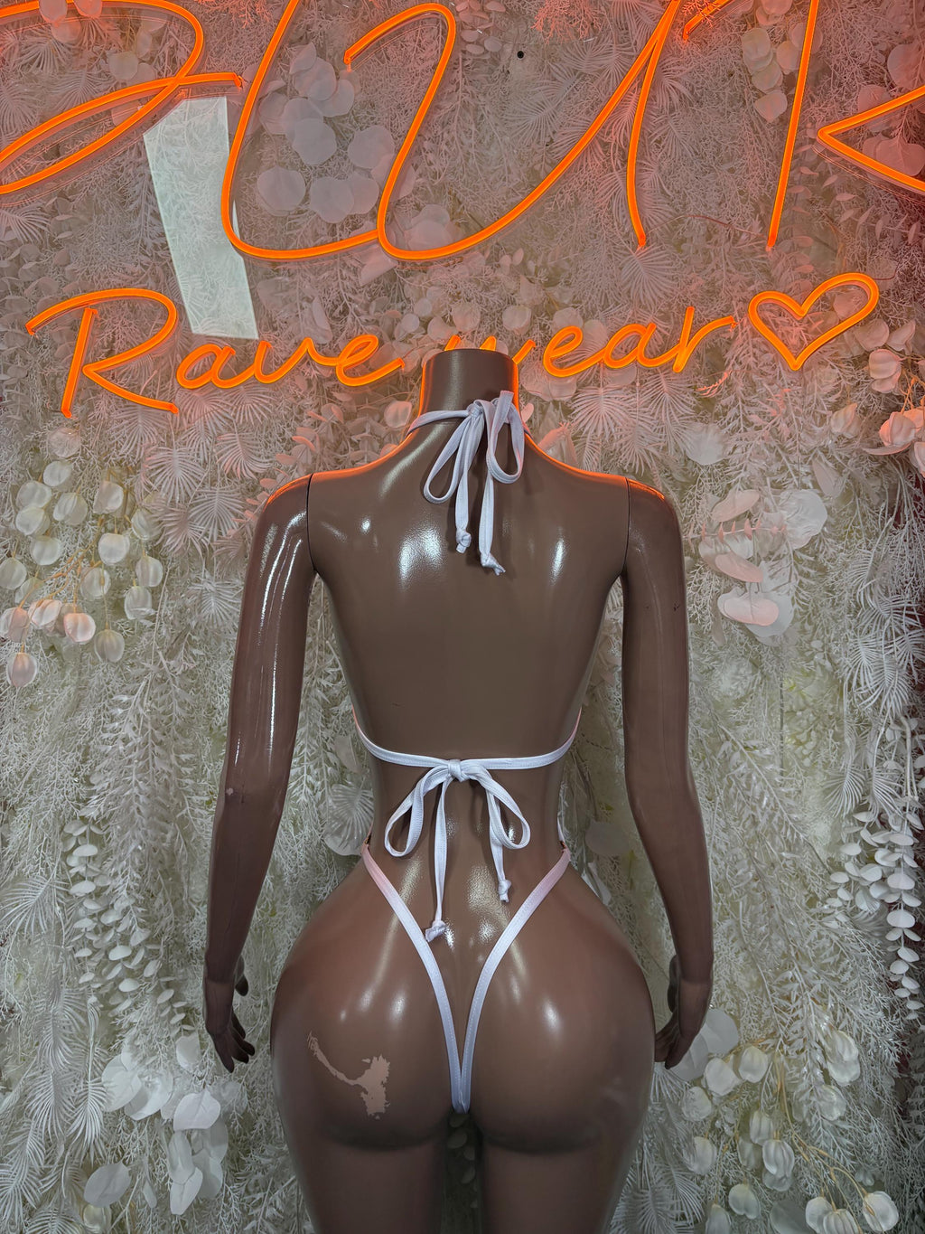White fishnet bodysuit with open back and tie neck straps