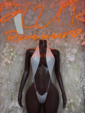 Metallic white bodysuit with V-neck, halter straps, high-cut front on mannequin