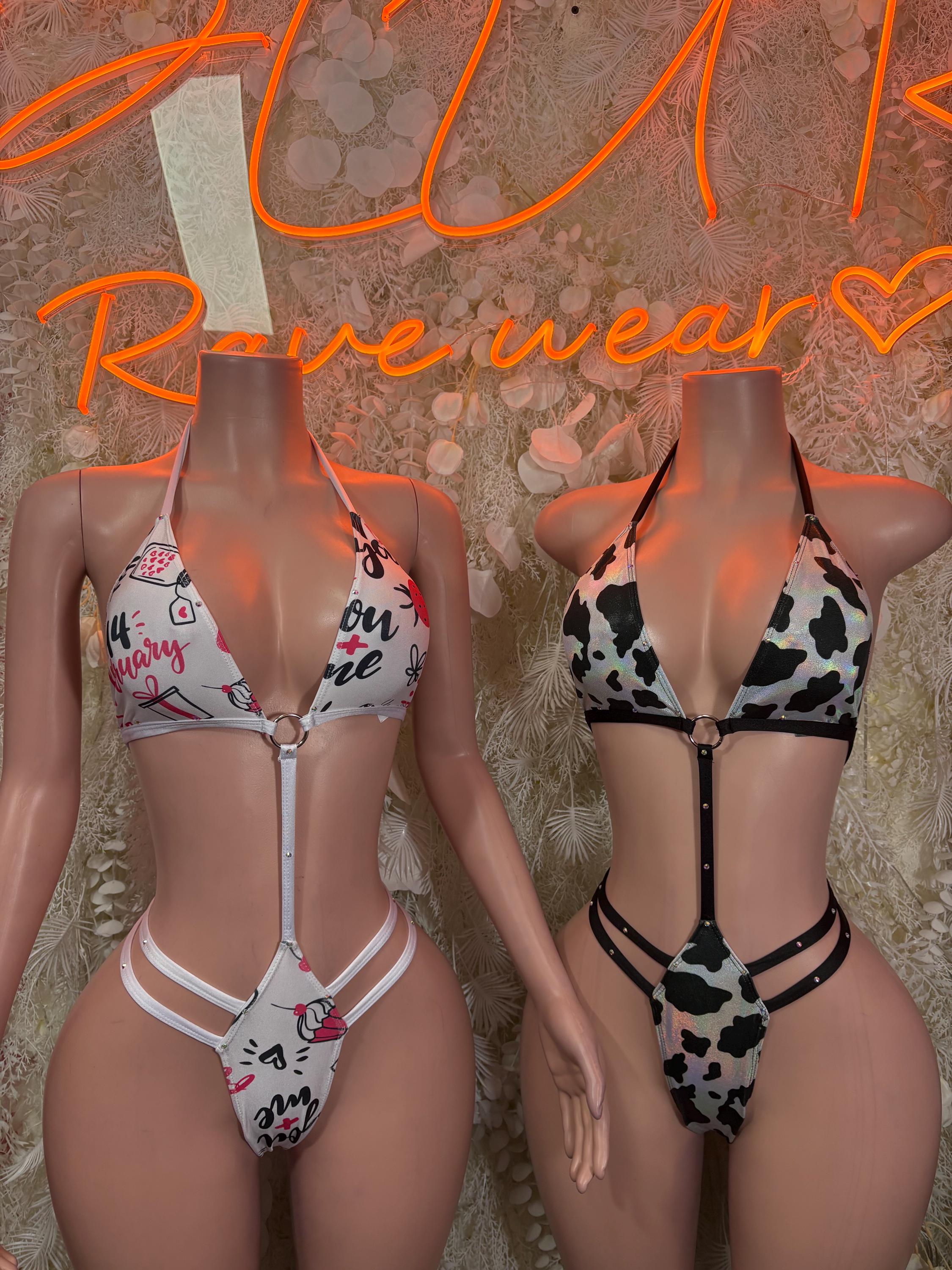 Two bikini sets: black-and-white cow print strappy set and white set with red accents