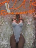 White mesh thong bodysuit with halter straps and V-neck, front on mannequin