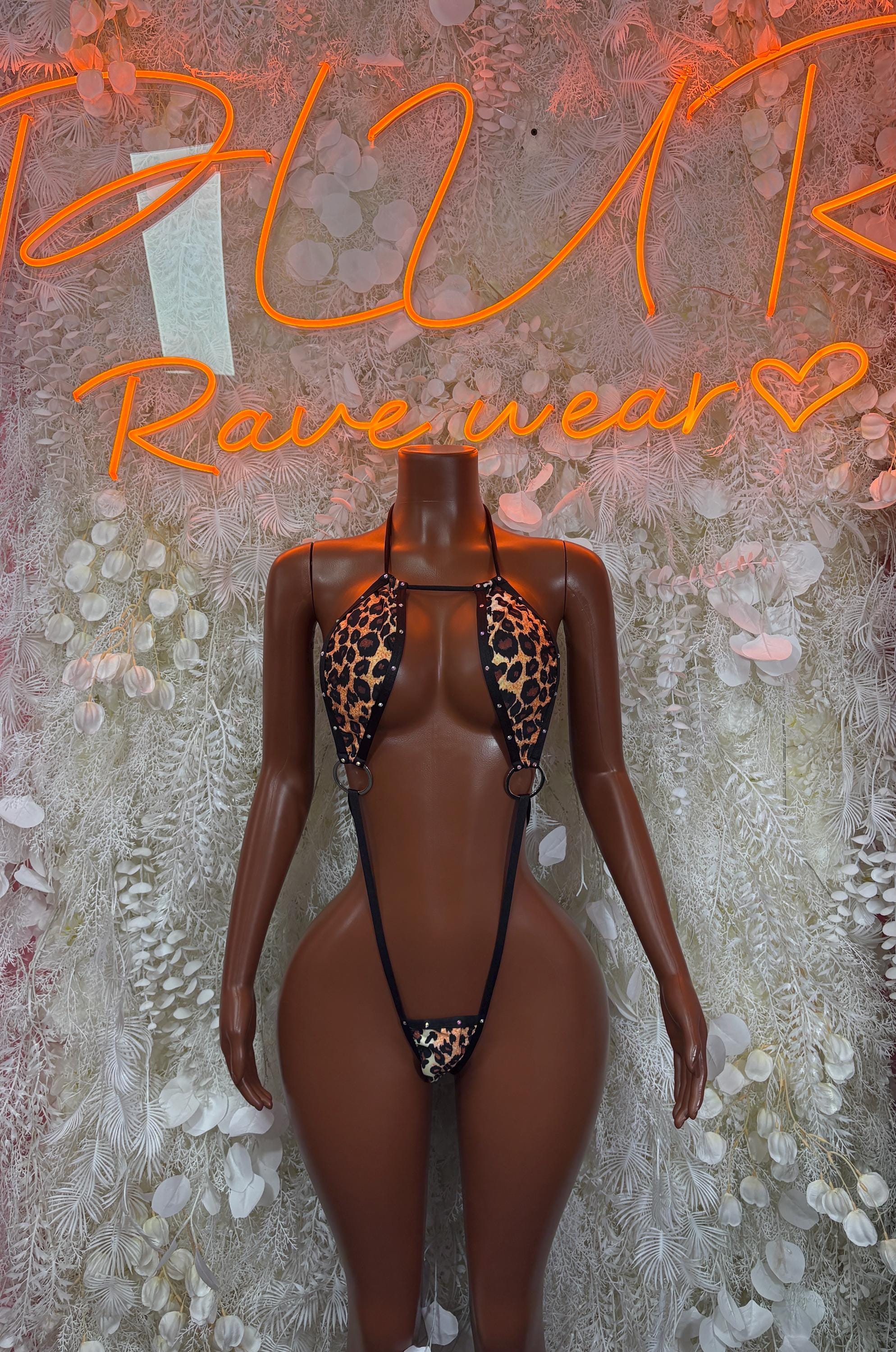 Leopard-print slingshot lingerie with black straps and thong-style front