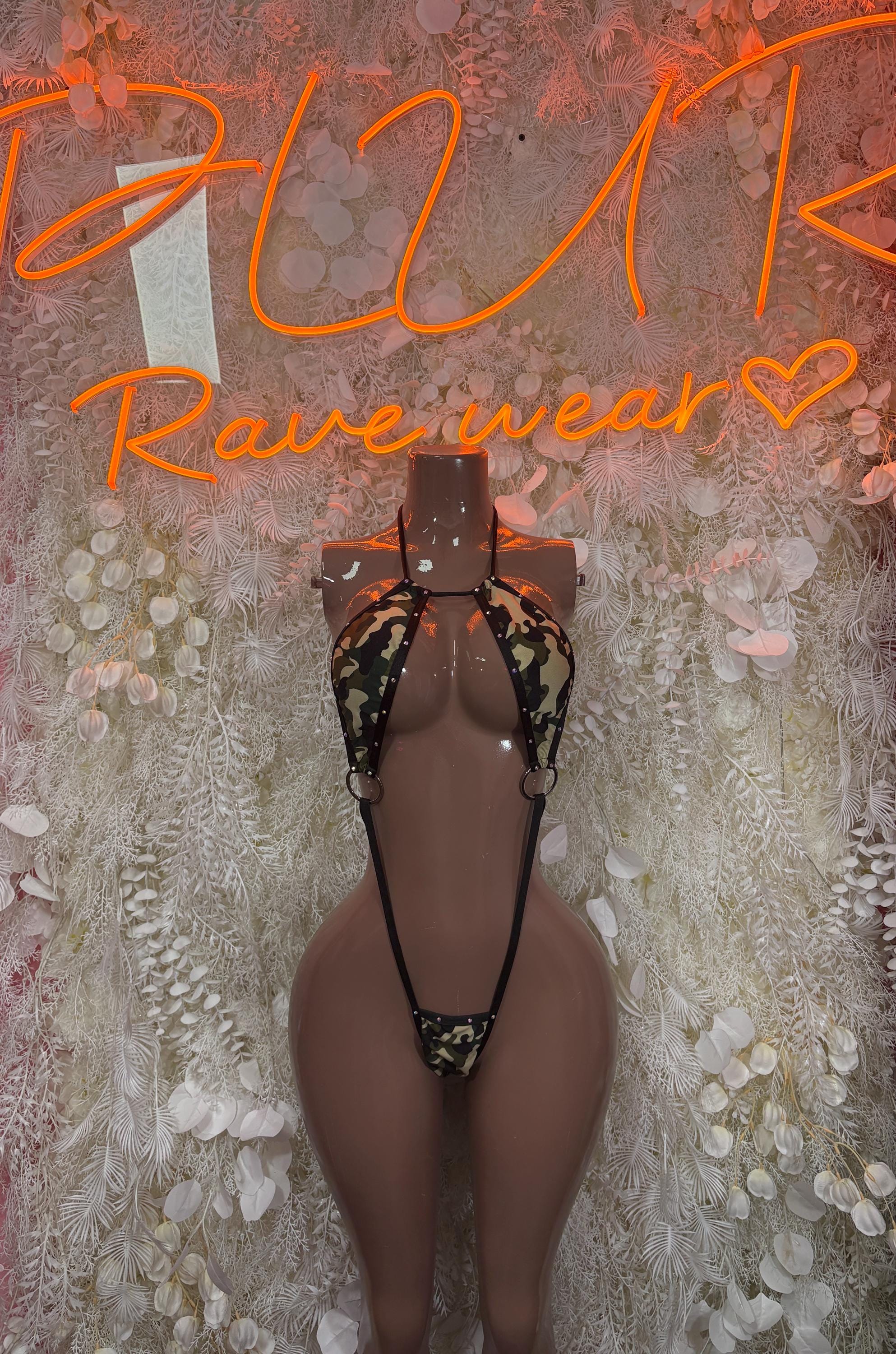 Black one-piece festival bodysuit with leopard-print panel and tie shoulder straps