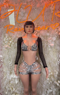 Snake print bodysuit with black mesh sleeves, lace-up shorts and bra top