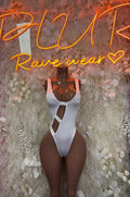 White bodysuit with deep side cutouts and thong-style high-leg bottom