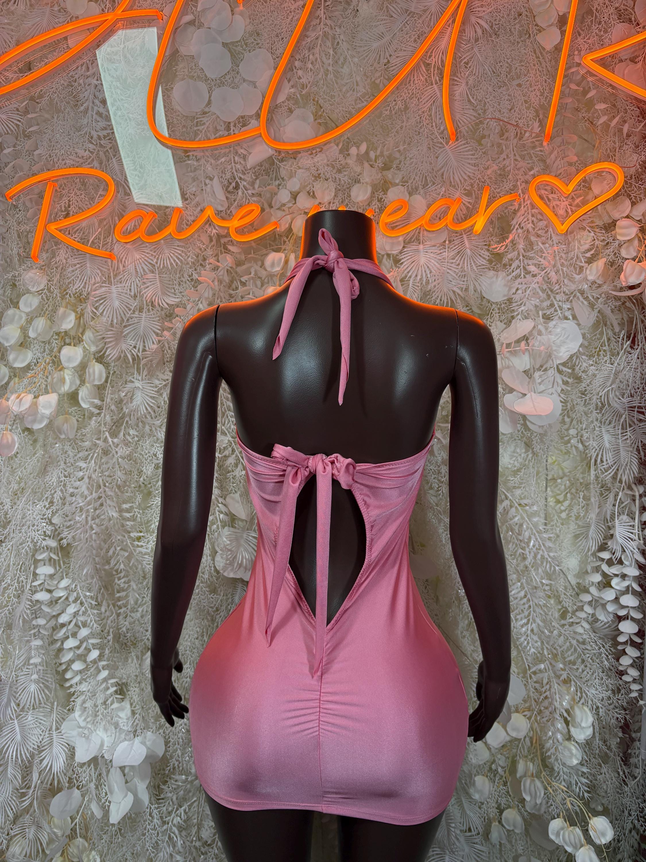 Pink backless mini dress with tie-back straps and ruched sides