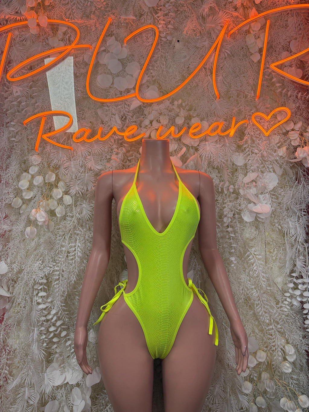 Neon green snake-print one-piece bodysuit with tie side straps, V-neck front