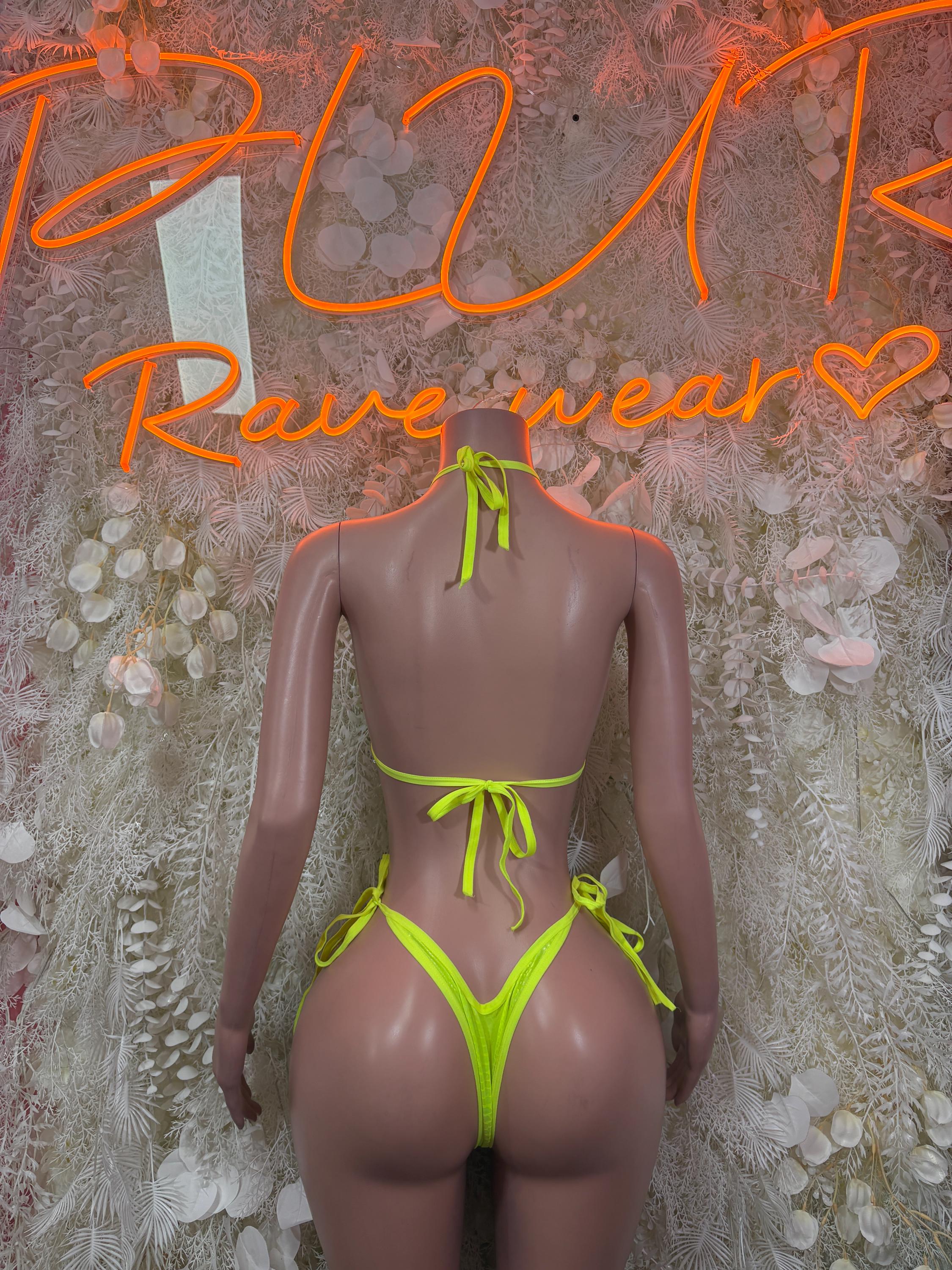 Neon green snake-print one-piece bodysuit with crisscross back straps and tie sides