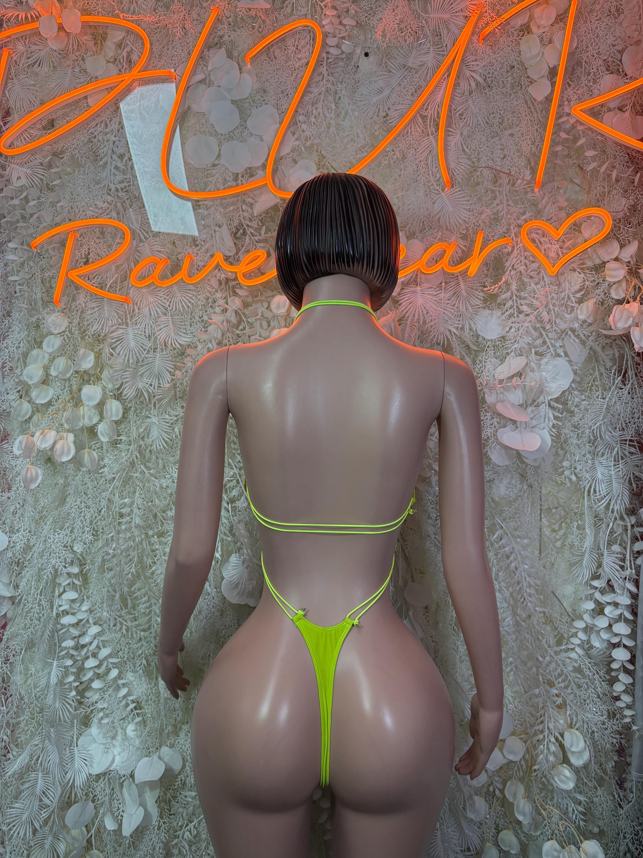 Neon green one-piece slingshot bodysuit with open back and thong cutout