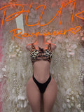 Leopard print and black mesh one-piece bodysuit with sheer panels, tie-back straps