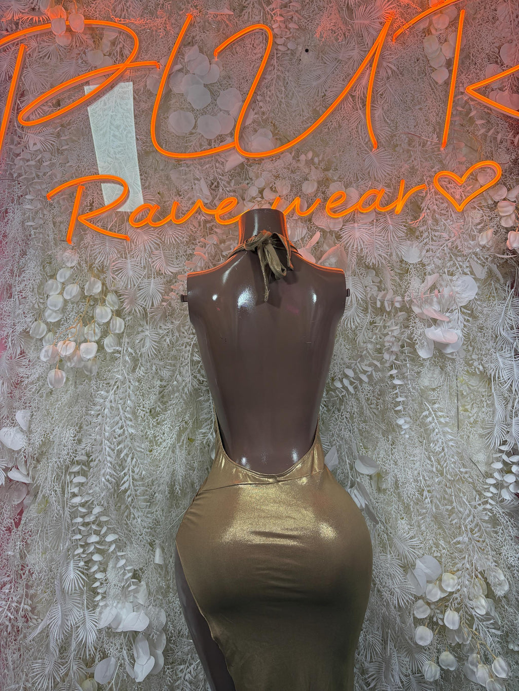 Metallic gold sleeveless halter dress with draped bust, bow neck, fitted skirt