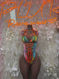 Black metallic tropical print bodysuit with deep V neckline and orange crisscross lace-up