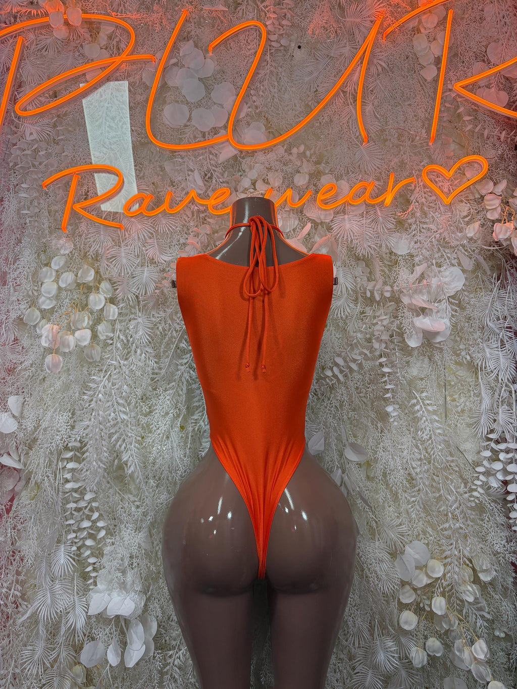 Orange sleeveless lace-up bodysuit with triangular front cutout