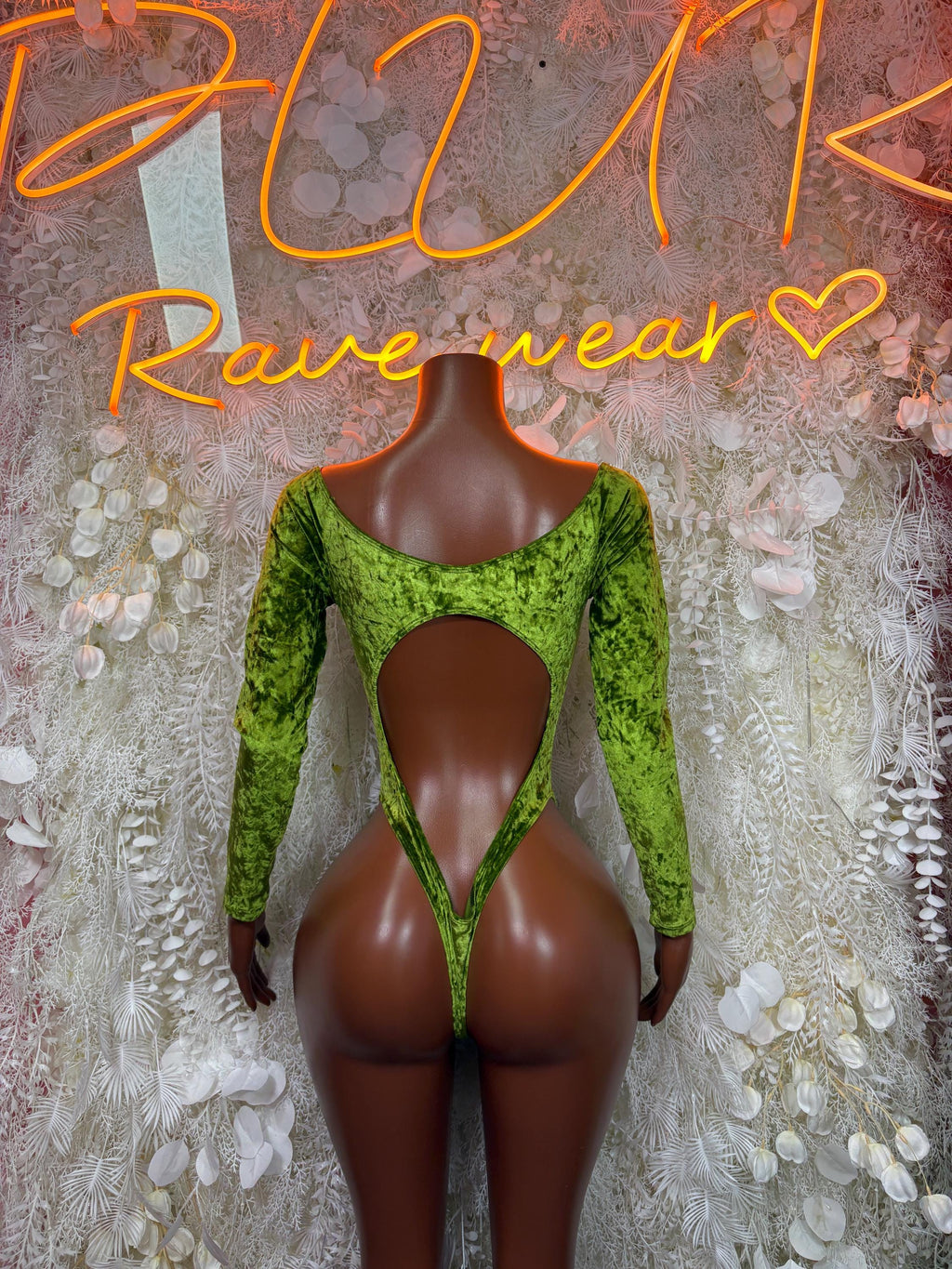 Green velvet bodysuit with long sleeves and deep V back cutout