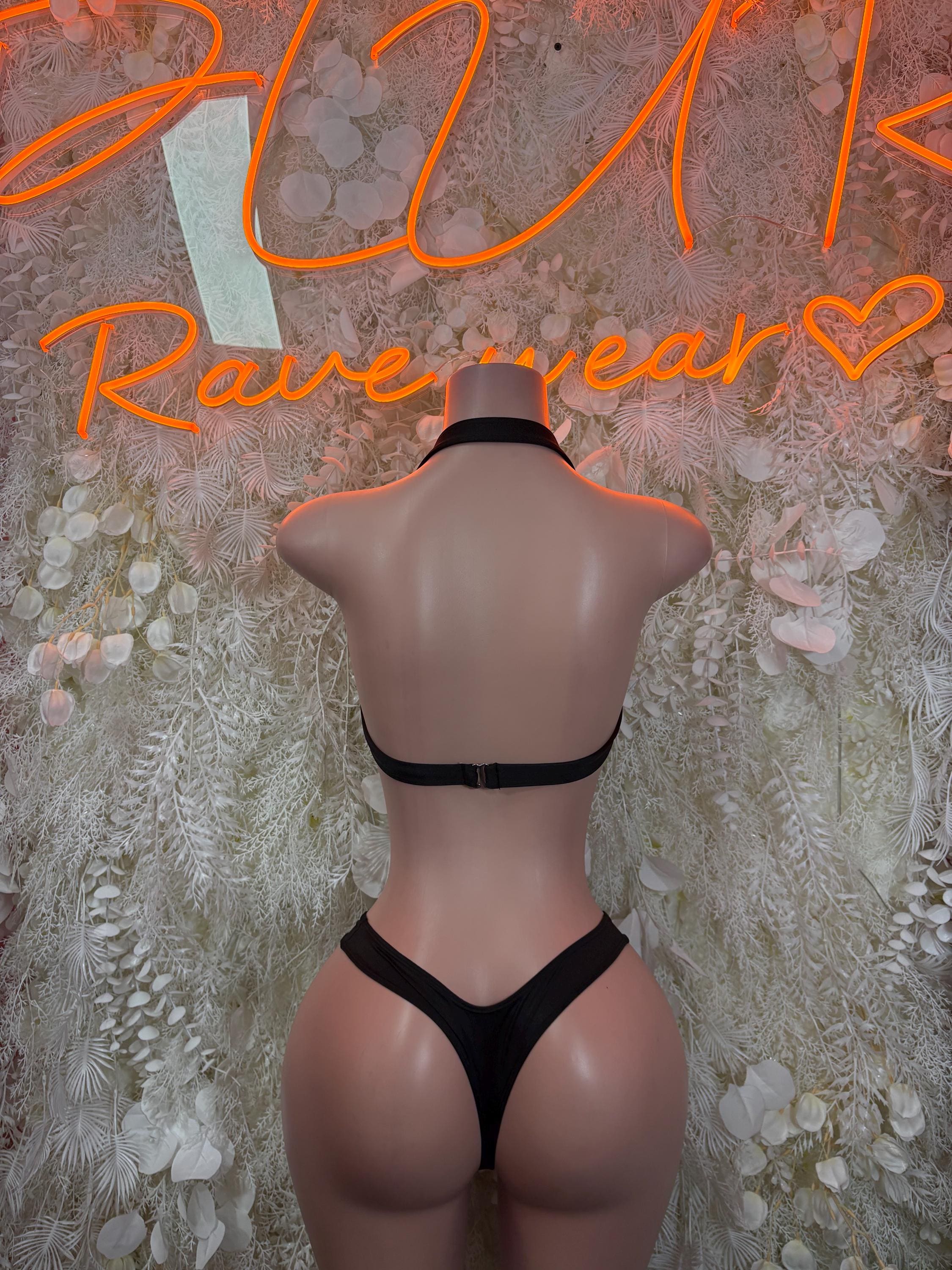 Back view: black lace bra with strappy band and black thong two-piece set