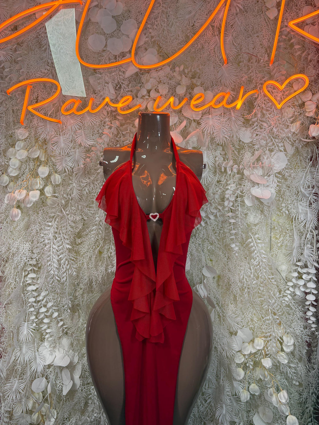 Red ruffle halter gown with sheer sleeves and draped front