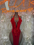 Red ruffle halter gown with sheer sleeves and draped front