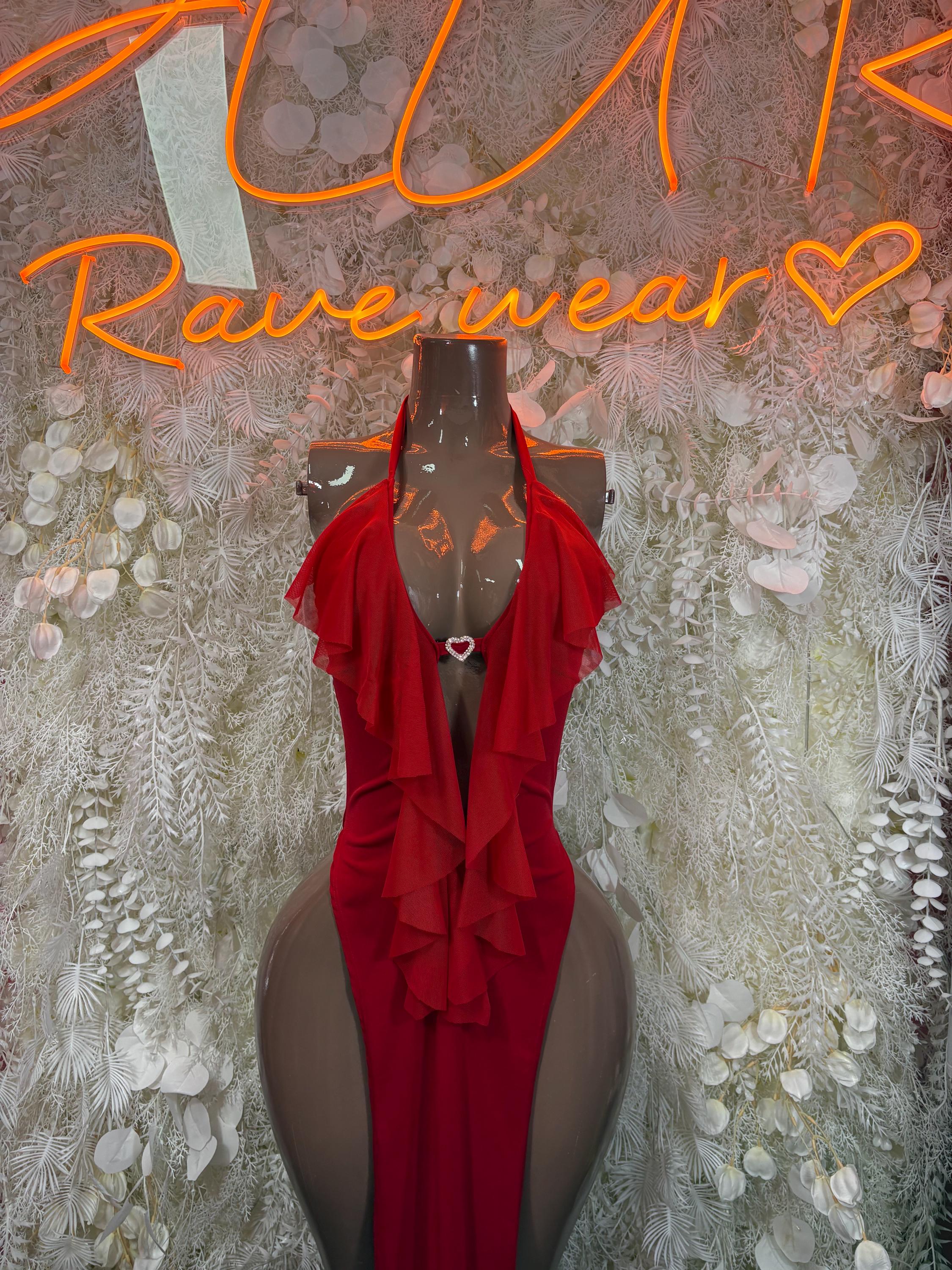 Red ruffle halter gown with sheer sleeves and draped front