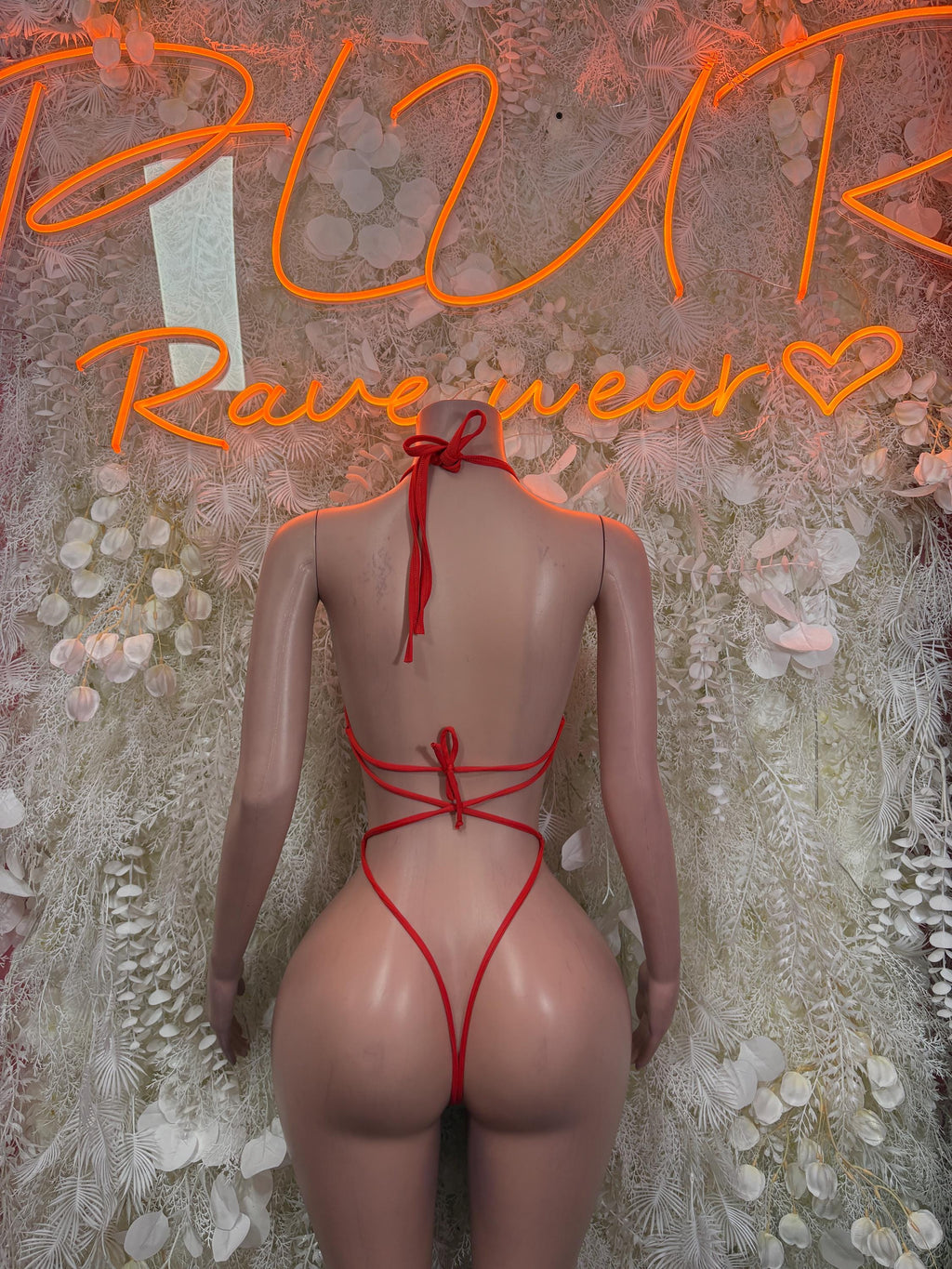 Coral fishnet bodysuit with tie-back straps and open back