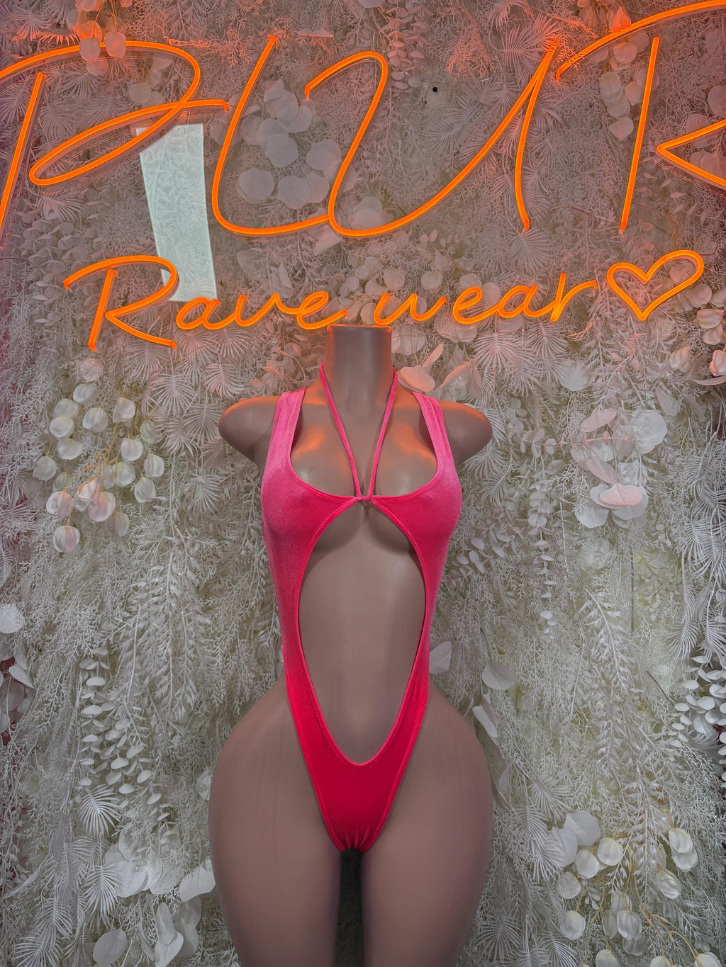 Pink velvet bodysuit with open back and narrow cross straps
