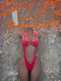Pink velvet bodysuit with open back and narrow cross straps