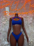 Royal blue two-piece dancewear set with cutout halter bra and matching thong bottoms