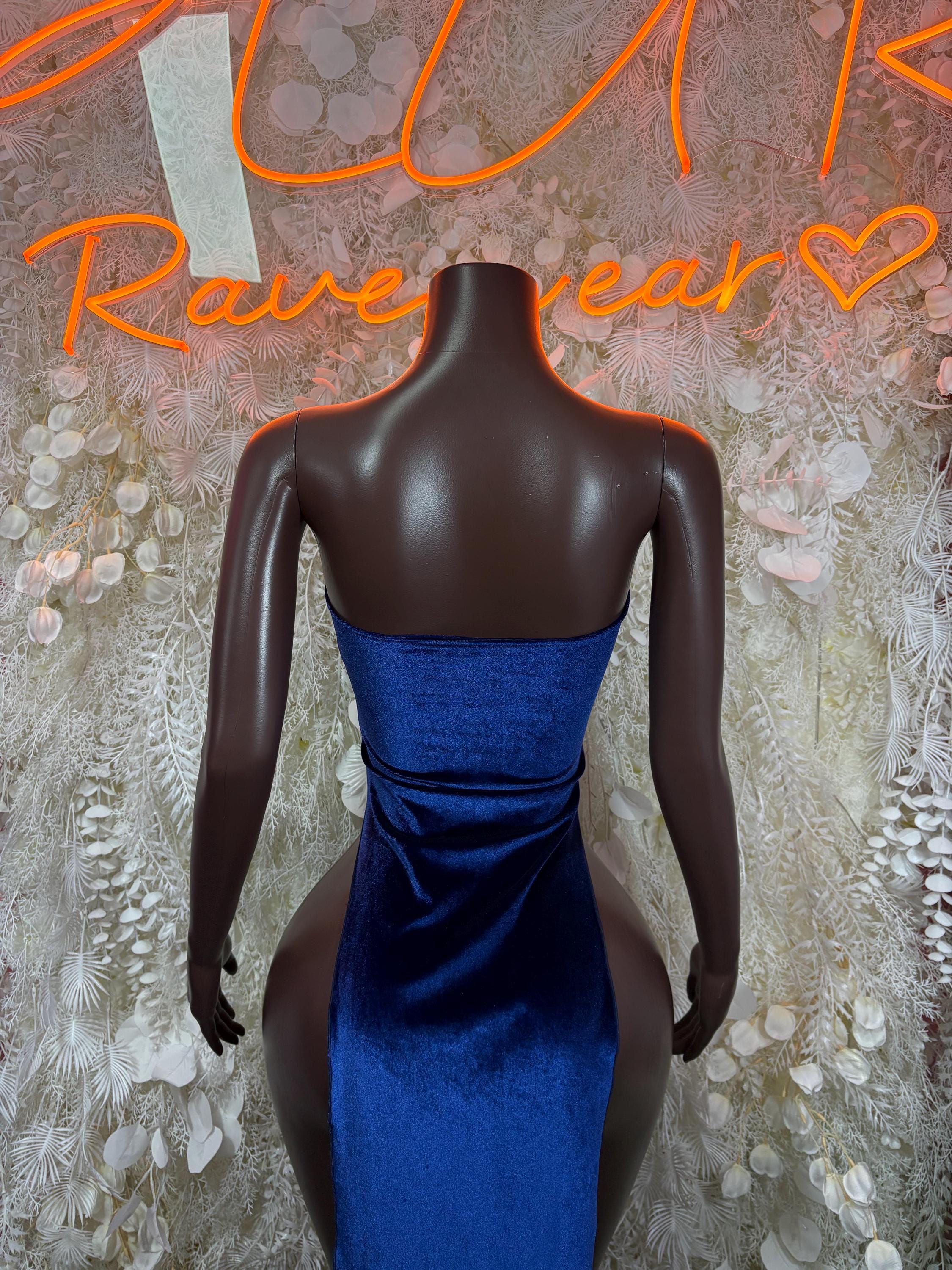 Royal blue velvet open-back halter gown with draped waist and ruched sides