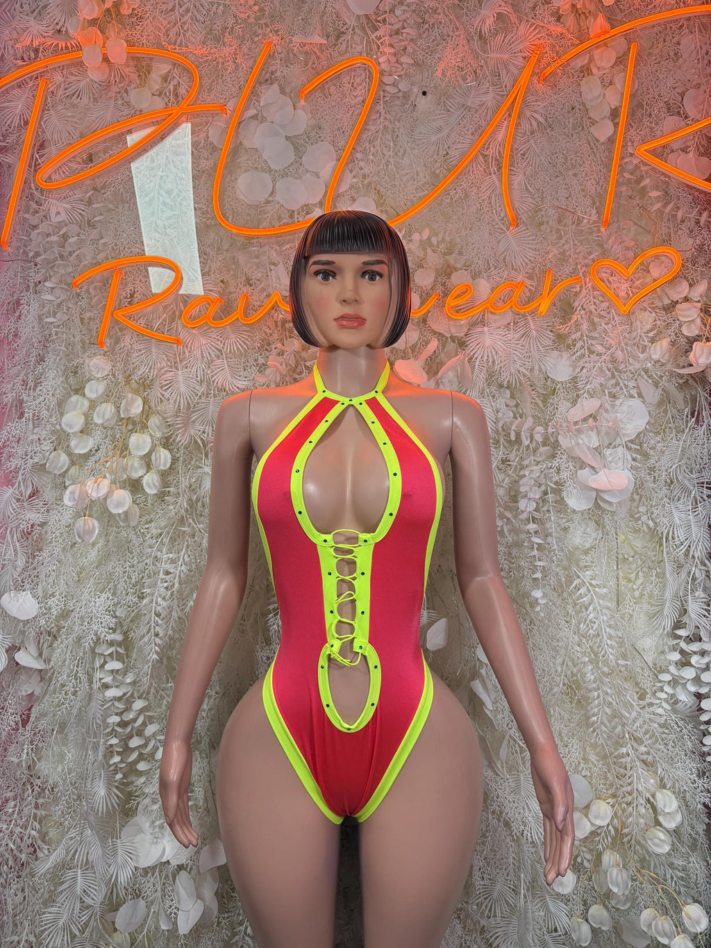 Halter one-piece bodysuit with neon coral and neon green trim, front view