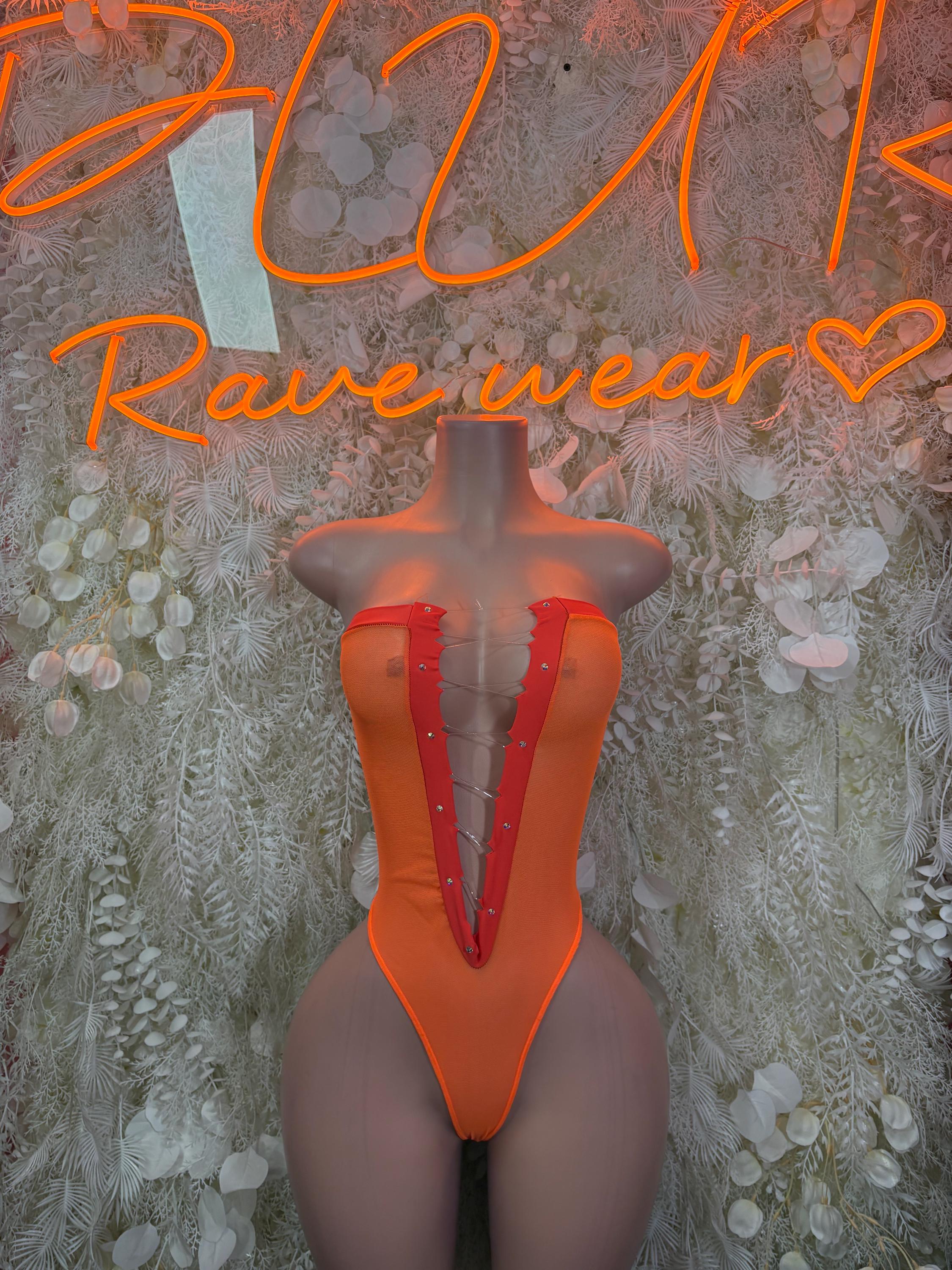 Orange V-neck halter bodysuit with central seam and sheer panels at sides