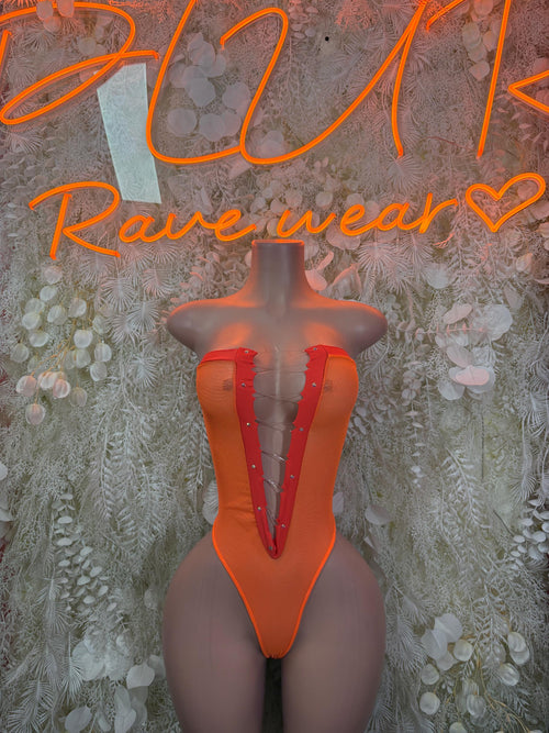 Orange V-neck halter bodysuit with central seam and sheer panels at sides