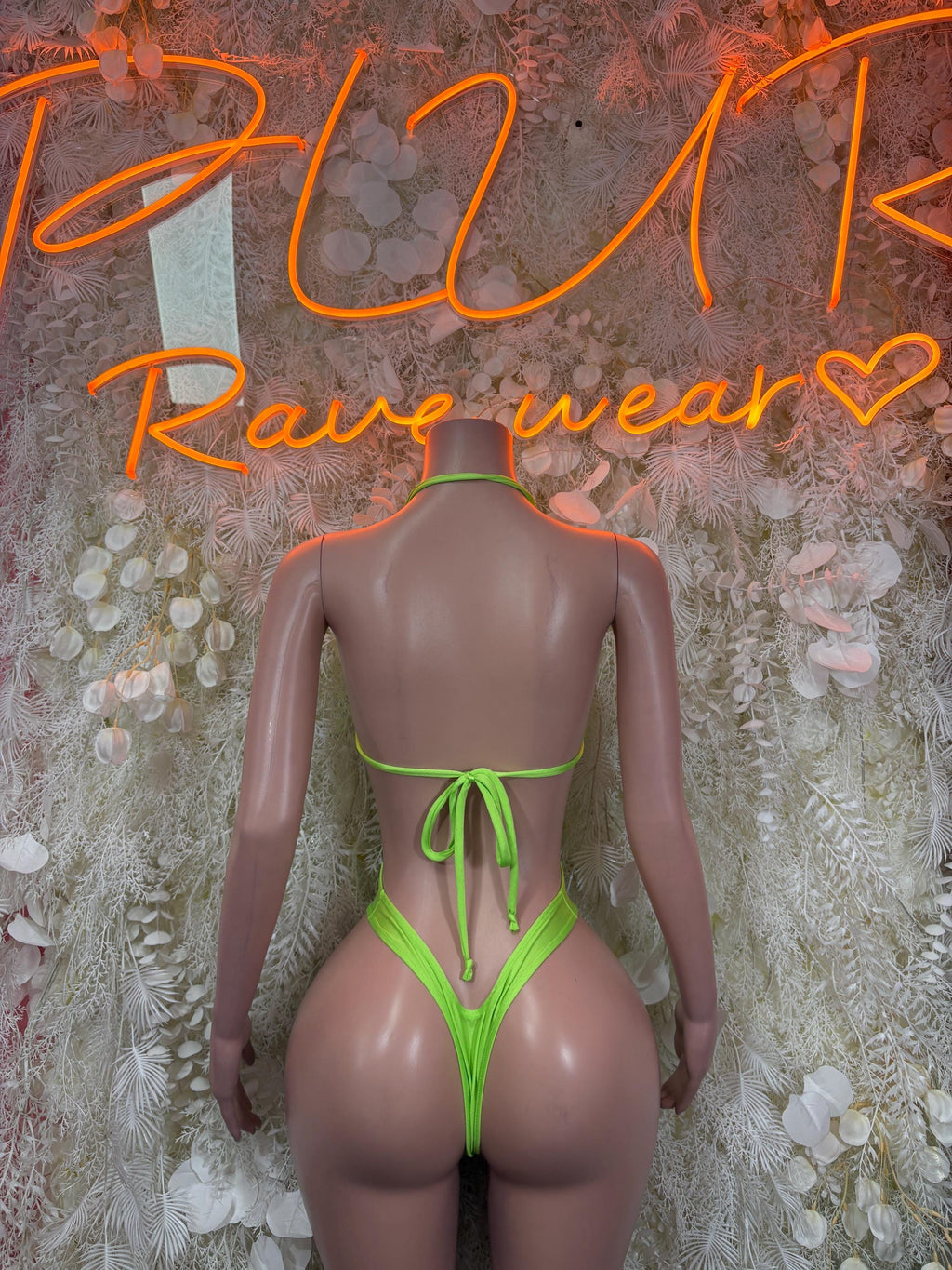 Neon green backless bodysuit with tie detail and thin adjustable straps