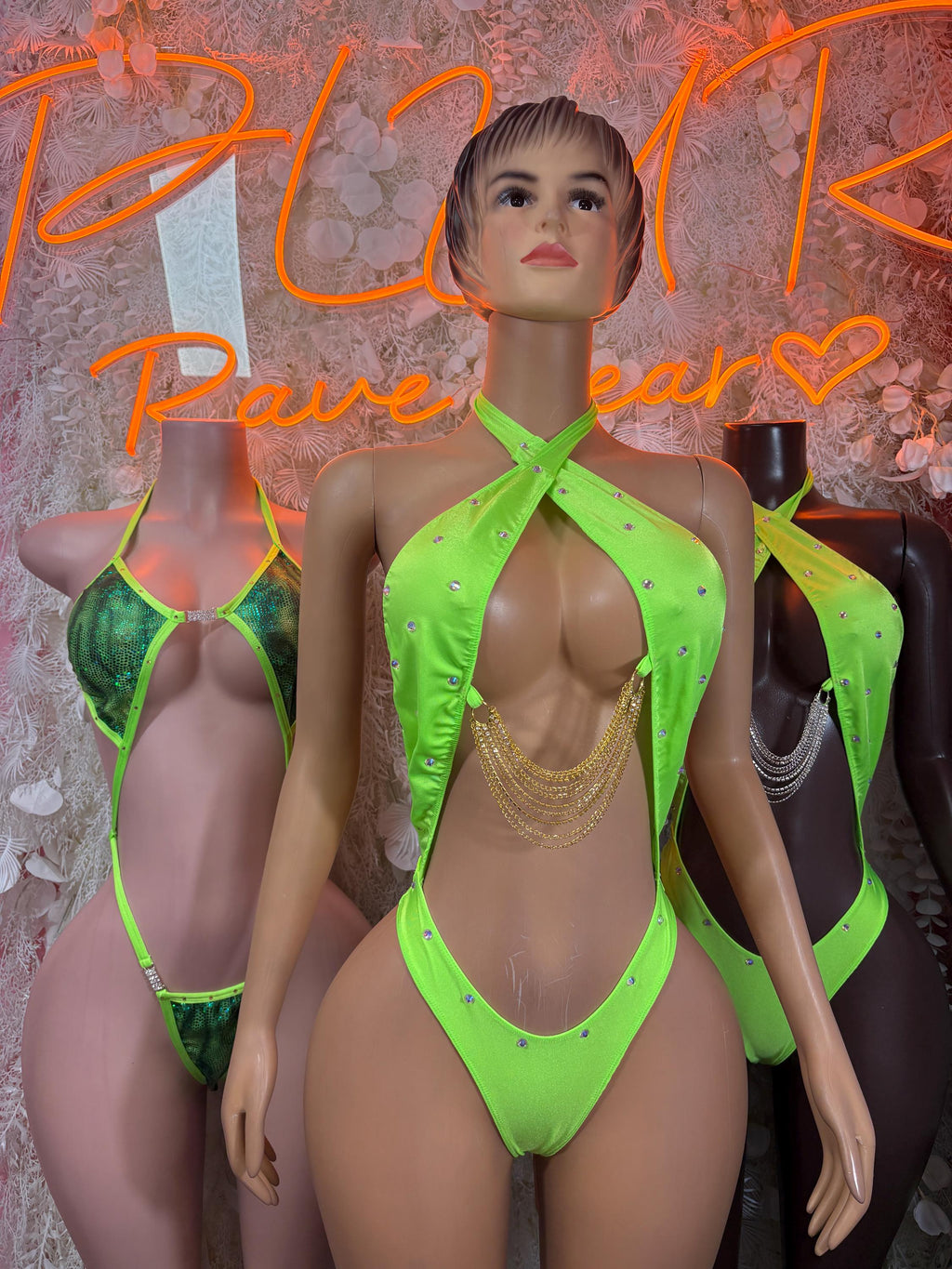 Neon green halter bodysuit with studded cups and gold chain detail