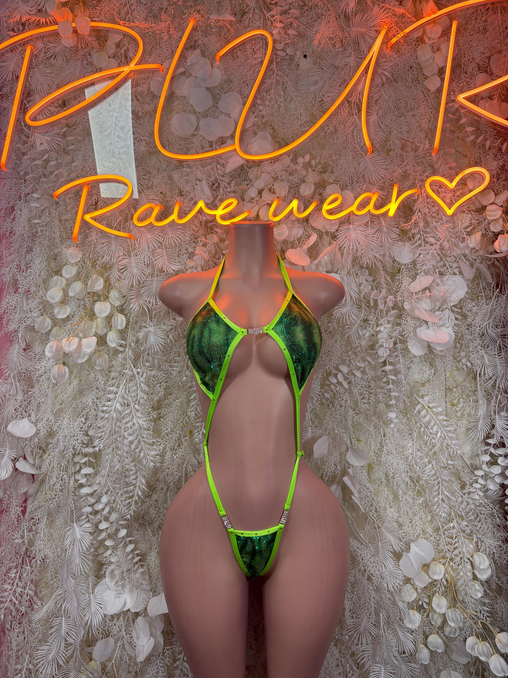 Neon green strappy bodysuit with plunging front and cheeky coverage