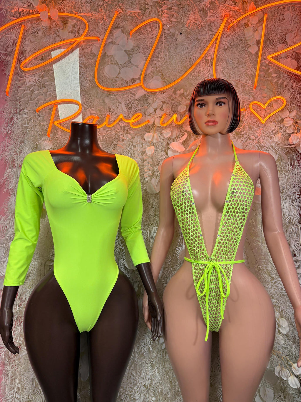 Neon green long-sleeve bodysuit with front zipper on display
