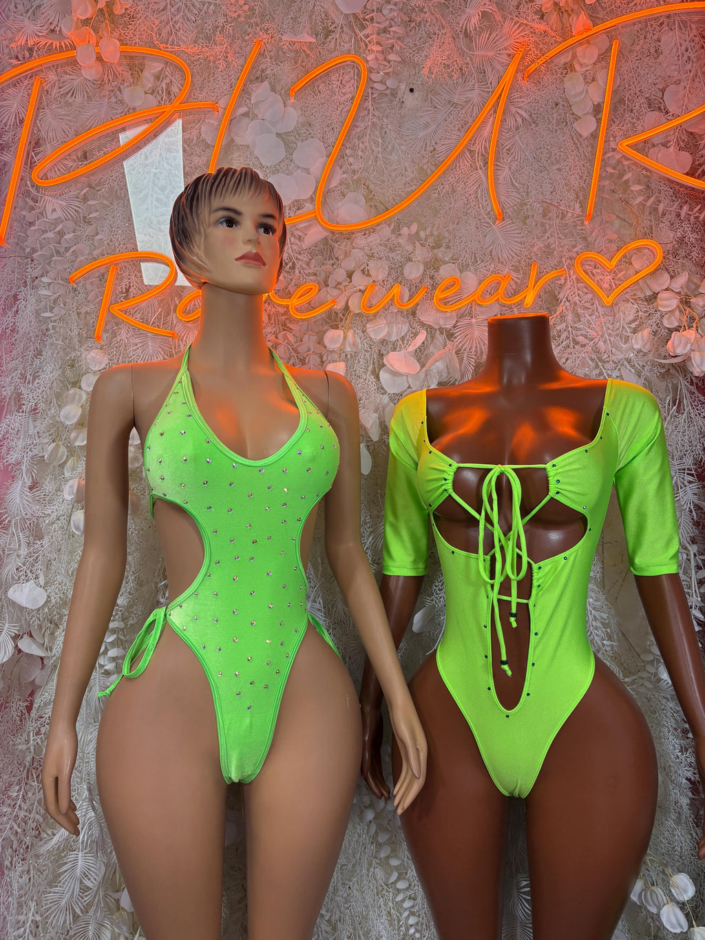 Neon green one-piece bodysuit with rhinestone dots, low back, and tie front