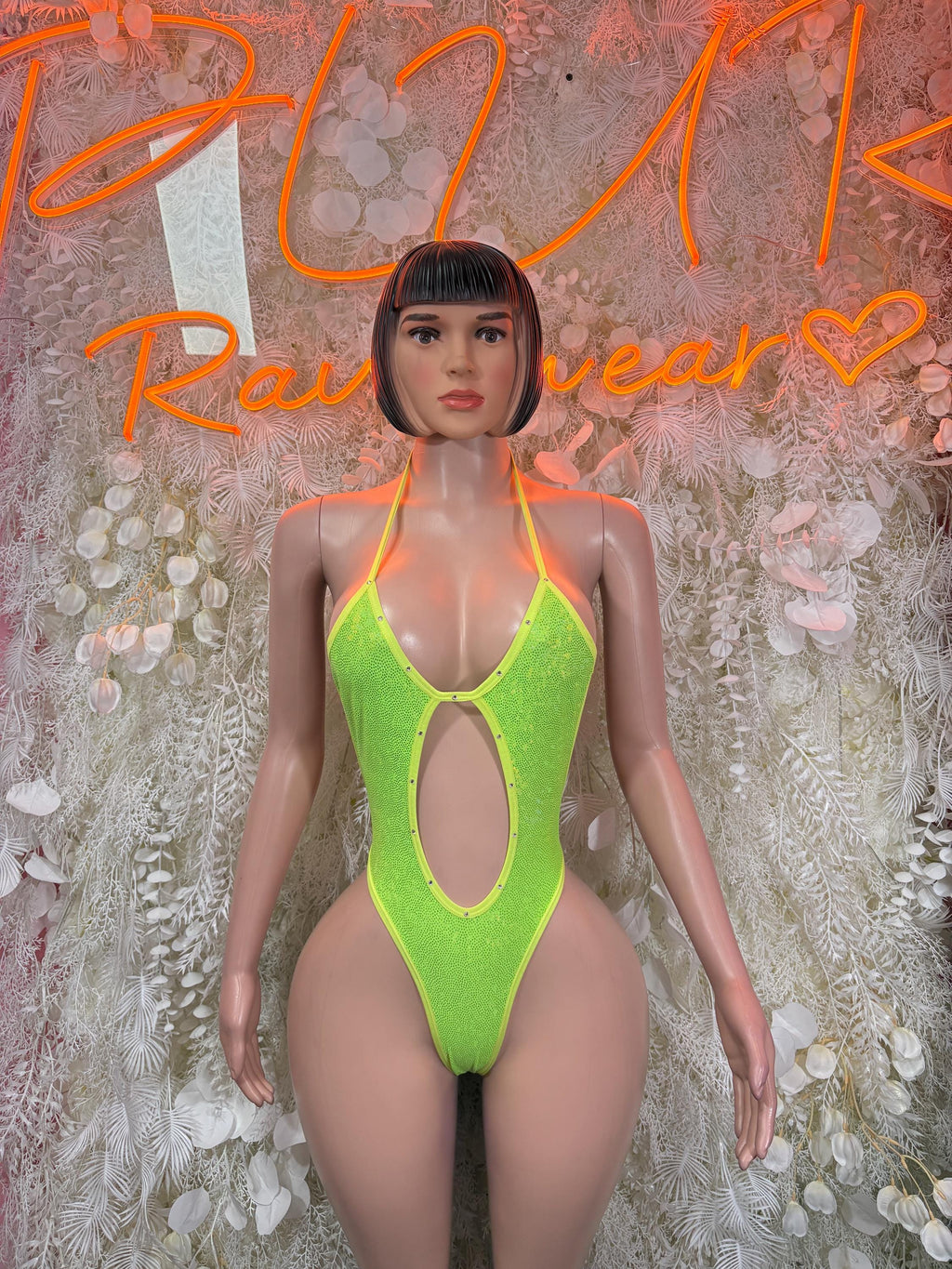 Neon green metallic bodysuit with high-cut leg and front keyhole cutout, tie straps