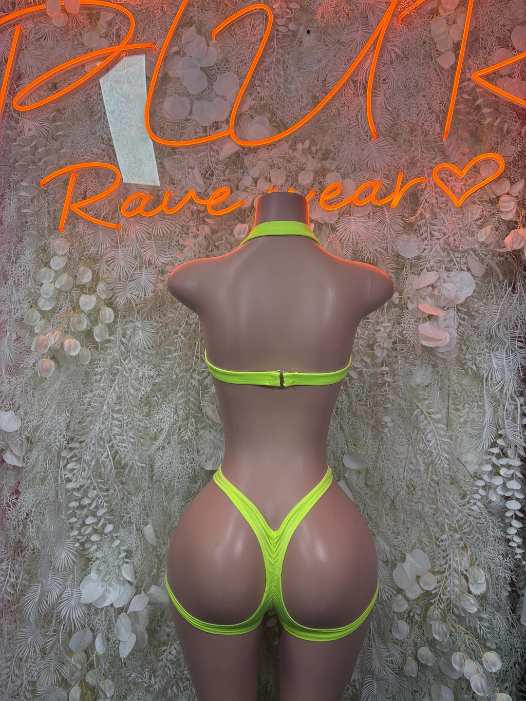 Neon green lace halter crop top and high-cut bikini bottoms, back view