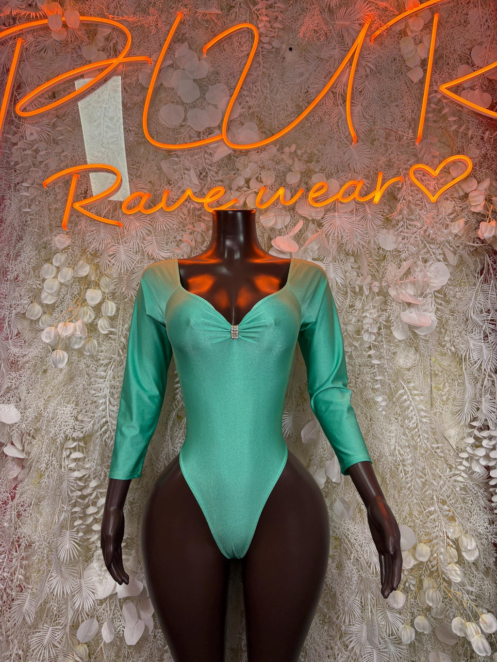 Teal long-sleeve metallic bodysuit with front zipper and high-cut legs