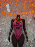 Hot pink cheetah-pattern metallic one-piece bodysuit with lace-up chest cutout
