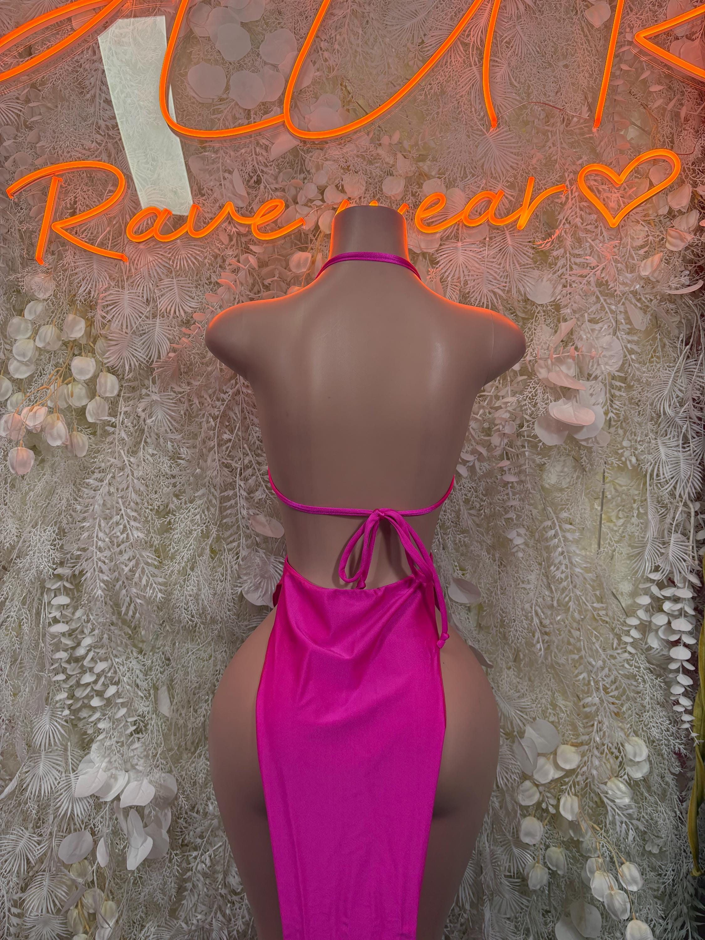Back view of magenta rhinestone halter gown with crisscross straps and bow tie