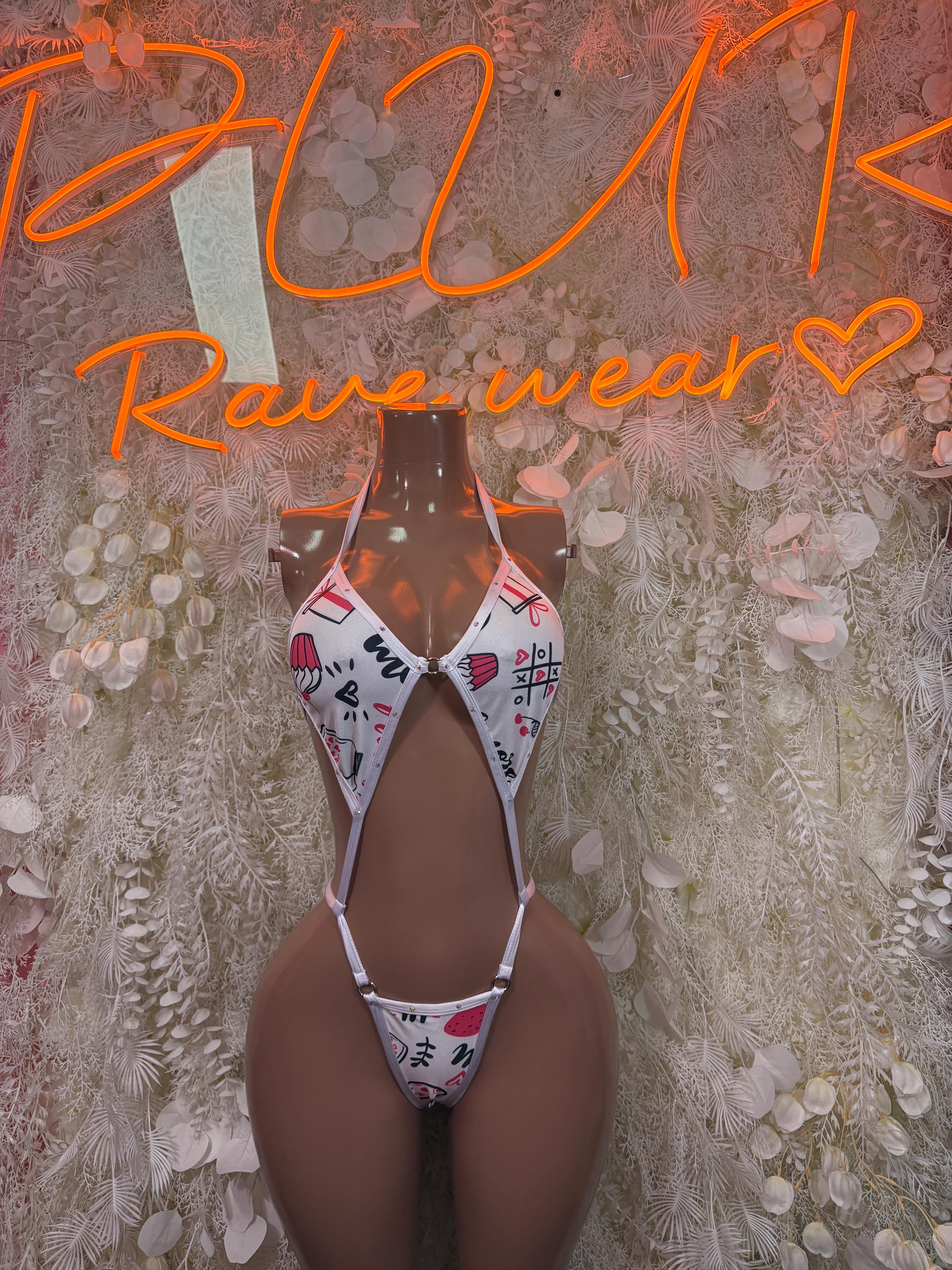 White printed one-piece bodysuit with strappy cutouts and small back thong ties